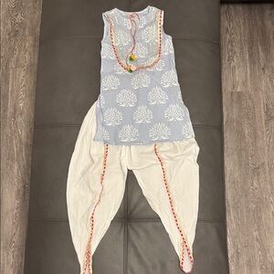 Blue Sleeveless top with white genie pants Colorful Details